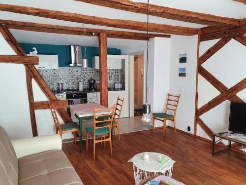a kitchen and dining room with a table and chairs at Kellerei5 Ferienwohnung 2 in Ochsenfurt