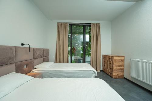 Postel nebo postele na pokoji v ubytování Villa Ipanema