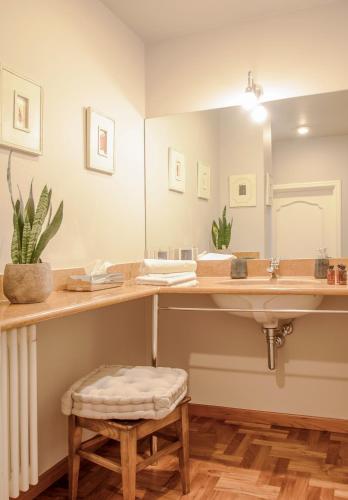 a bathroom with a sink and a mirror at B&B Casa Margot in Neive