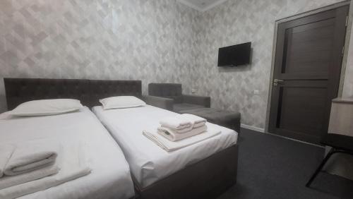 Postel nebo postele na pokoji v ubytování Shahriston Guest House