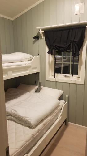 Säng eller sängar i ett rum på Bitigrenda F