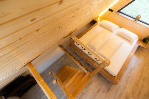 Postel nebo postele na pokoji v ubytování Pensiunea Casa Iulia A-Frame