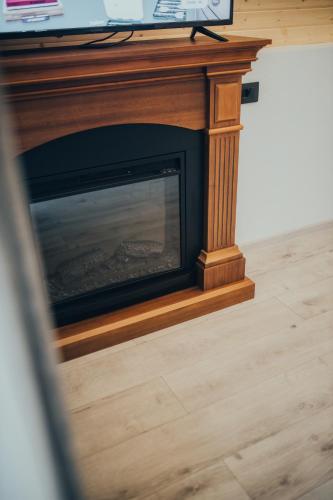 TV a/nebo společenská místnost v ubytování Pensiunea Casa Iulia A-Frame