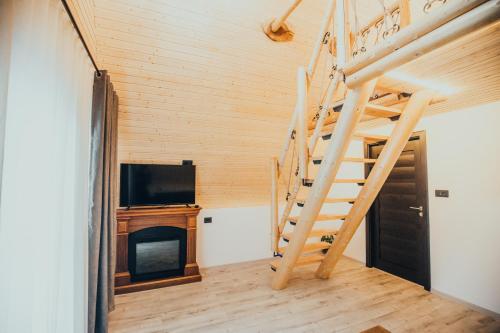 TV a/nebo společenská místnost v ubytování Pensiunea Casa Iulia A-Frame