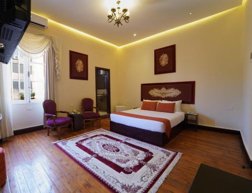 Postel nebo postele na pokoji v ubytování Victoria Cairo Hotel