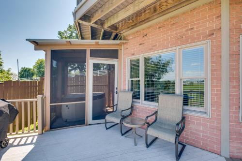 a patio with two chairs and a table on a deck at 4 Mi to German Village Studio with Hot Tub! in Millersburg