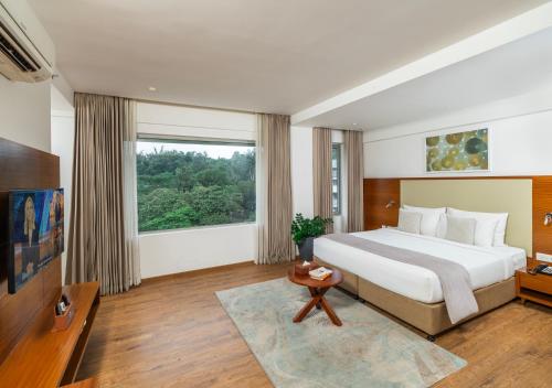 Postel nebo postele na pokoji v ubytování Oshin Hotel
