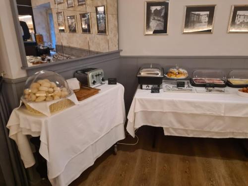 two tables in a restaurant with food on them at Il Sole in Bergamo