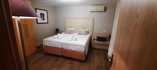 Кровать или кровати в номере All Season Apartments