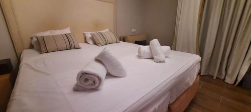 Кровать или кровати в номере All Season Apartments