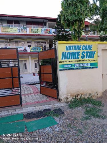 a home stay sign in front of a building at Nature Care Home stay in Chandīgarh