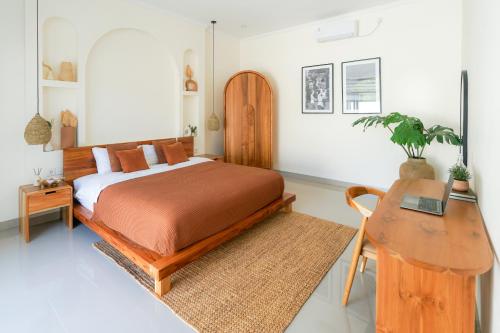 Giường trong phòng chung tại Villa Suksma Canggu