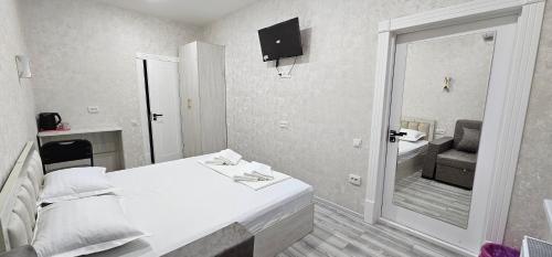 Postel nebo postele na pokoji v ubytování Shahriston Guest House