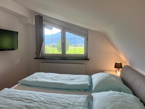 Ένα ή περισσότερα κρεβάτια σε δωμάτιο στο Mooslodge