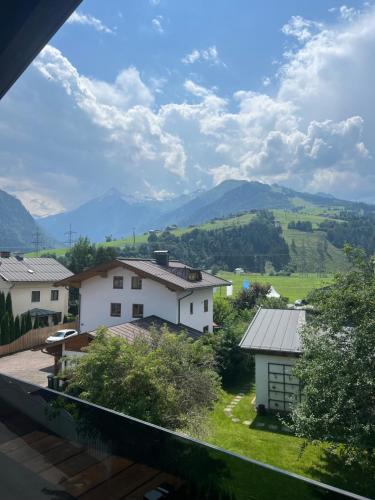 a view of a village with mountains in the background at Mooslodge in Kaprun
