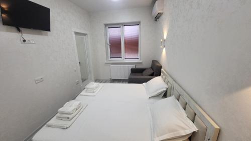 Postel nebo postele na pokoji v ubytování Shahriston Guest House