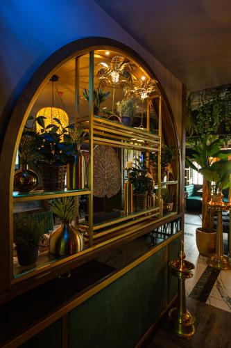 a shop with a window with potted plants in it at President Hotel in Dubai