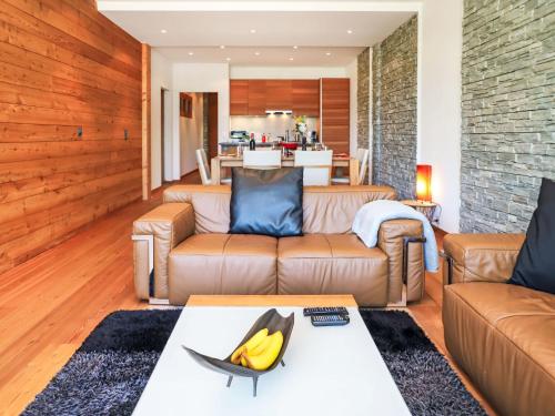 a living room with a couch and a table at Apartment Rosablanche D 203A by Interhome in Siviez