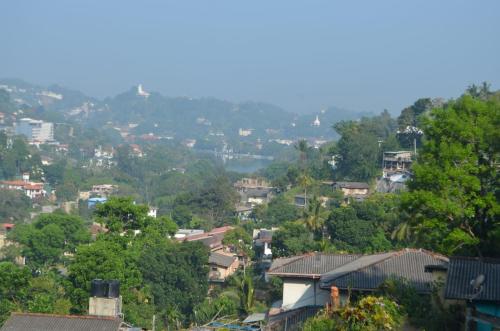 a view of a city with houses and trees at Laaya Kandy in Kandy
