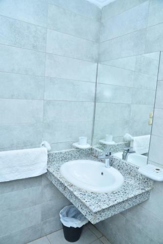 a bathroom with a sink and a mirror at Miramar Green Talaat harb in Cairo