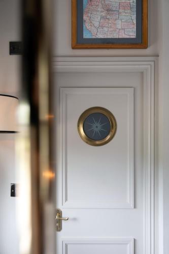 a door with a clock on top of it at The Pilot Inn in London