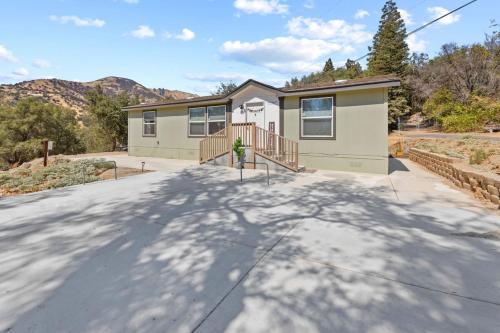 a house on a street with a driveway at Minutes from Sequoia Entrance in Three Rivers