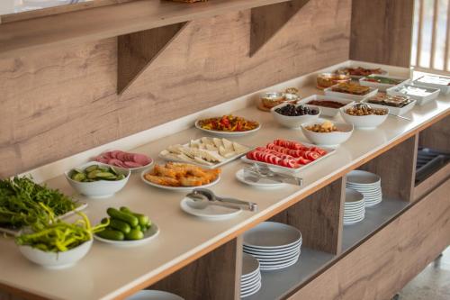 a buffet with different types of food on a table at E87 Highway Otel in Burhaniye