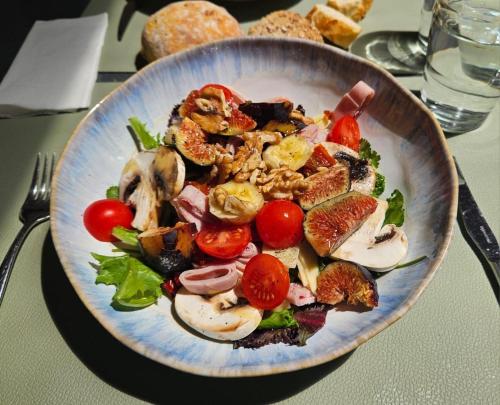a plate of food with vegetables on a table at Eleven, Boutique luxury house & garden in Boliqueime