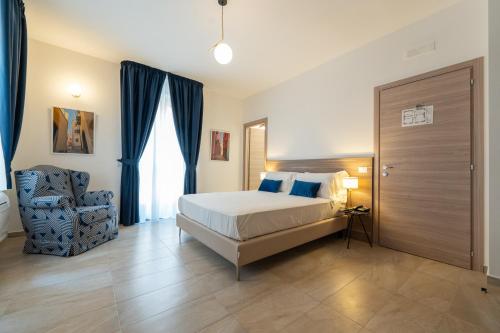 Ένα ή περισσότερα κρεβάτια σε δωμάτιο στο Boutique Hotel Palazzo Donna Iulia