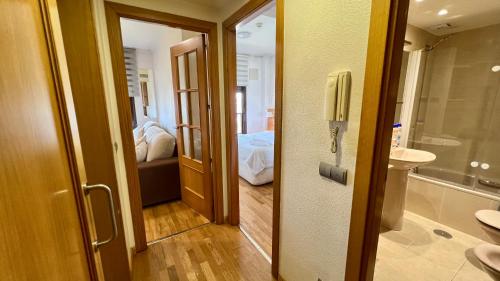 a bathroom with a toilet and a sink and a mirror at House Samaniego 12 in Madrid