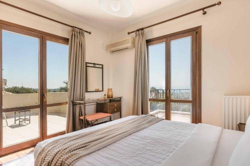 Postel nebo postele na pokoji v ubytování Villa Theodoros