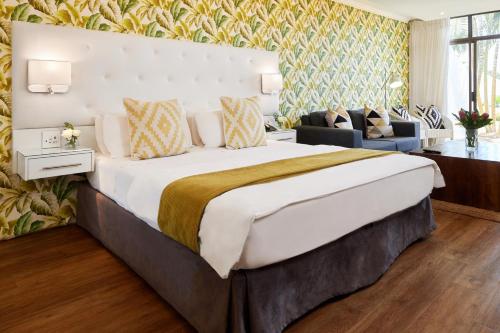 Katil atau katil-katil dalam bilik di First Group Breakers Resort - Official