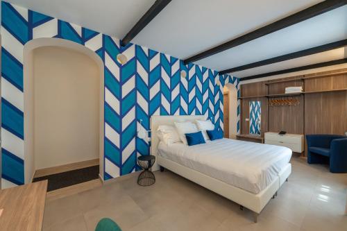 Ένα ή περισσότερα κρεβάτια σε δωμάτιο στο Boutique Hotel Palazzo Donna Iulia
