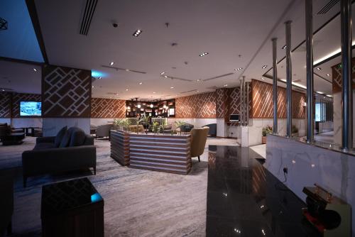 a lobby with a bar in a building at White Diamond Hotel Sari in Jeddah