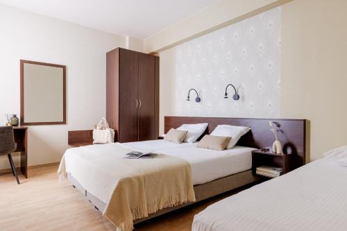 Postel nebo postele na pokoji v ubytování Hotel Corner House by WP Hotels