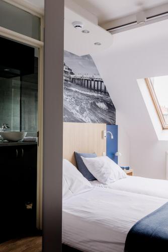 Cama o camas de una habitación en Enjoy Hotel Noordzee - Paradisio By WP Hotels
