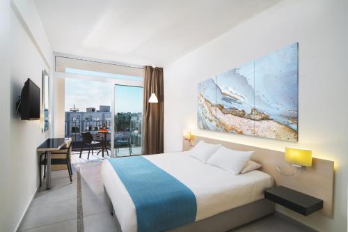 Postel nebo postele na pokoji v ubytování Mayfair Hotel