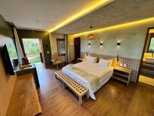 Postel nebo postele na pokoji v ubytování Hotel Vale das Nuvens