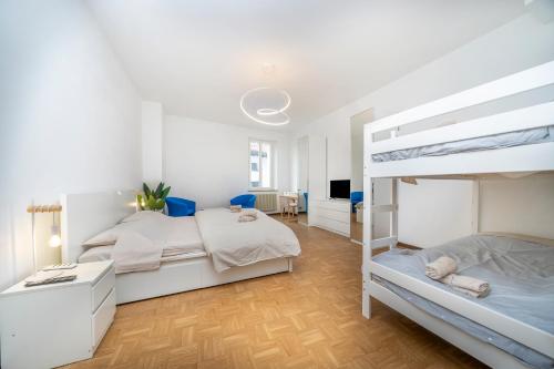 a bedroom with two bunk beds and a desk at Cividale Medieval Town Apartment in Cividale del Friuli