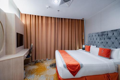 Postel nebo postele na pokoji v ubytování Wahaj Boulevard Hotel