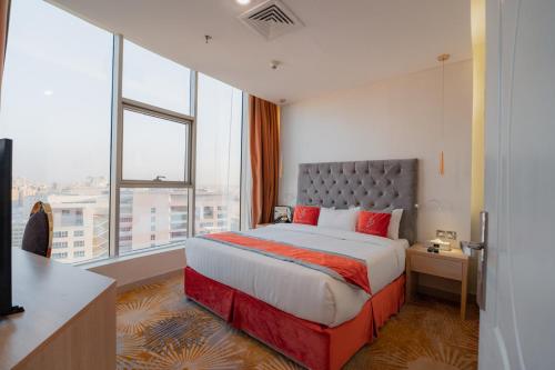 Postel nebo postele na pokoji v ubytování Wahaj Boulevard Hotel