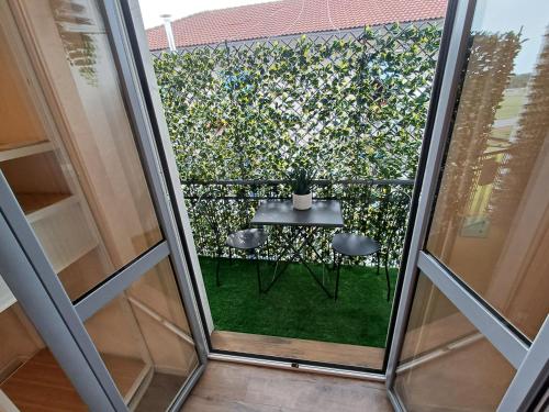 a view of a balcony with a table and chairs at Glam Milan Linate Airport in Milan