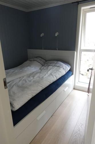 Postel nebo postele na pokoji v ubytování Hytte ved Andsvatnet