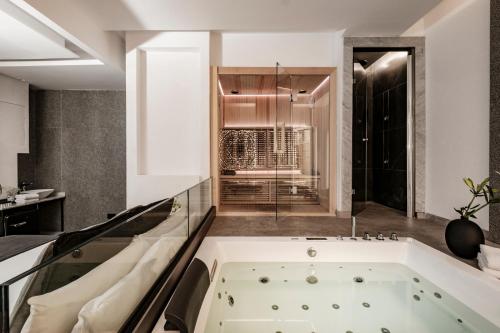 a bathroom with a bath tub in a room at Palazzo Ignazio in Valletta