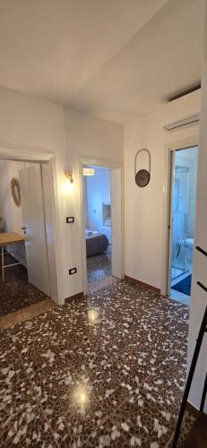 a living room with a large room with a floor at Ca' Olivo in Mogliano Veneto