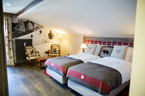 Giường trong phòng chung tại Hotel Bristol Verbier