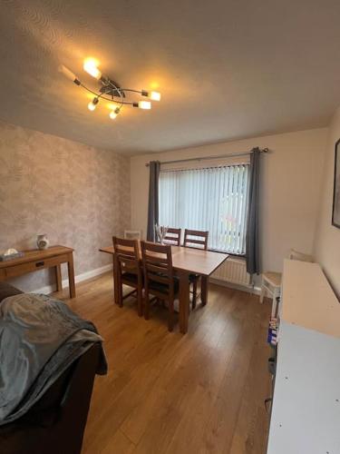 a living room with a dining room table and chairs at Marguerite Retreat in Newcastle