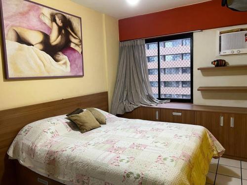 Ένα ή περισσότερα κρεβάτια σε δωμάτιο στο Apart Hotel quarto e sala mobiliado na Enseada do Sua