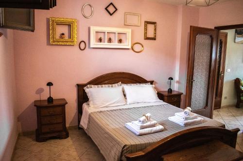 a bedroom with a bed with two towels on it at Il Baco da Seta in Sale San Giovanni