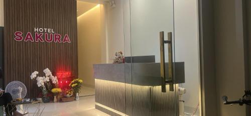 a lobby with a hotel avalonia sign on the wall at Sakura Hotel Thủ Đức in Ho Chi Minh City
